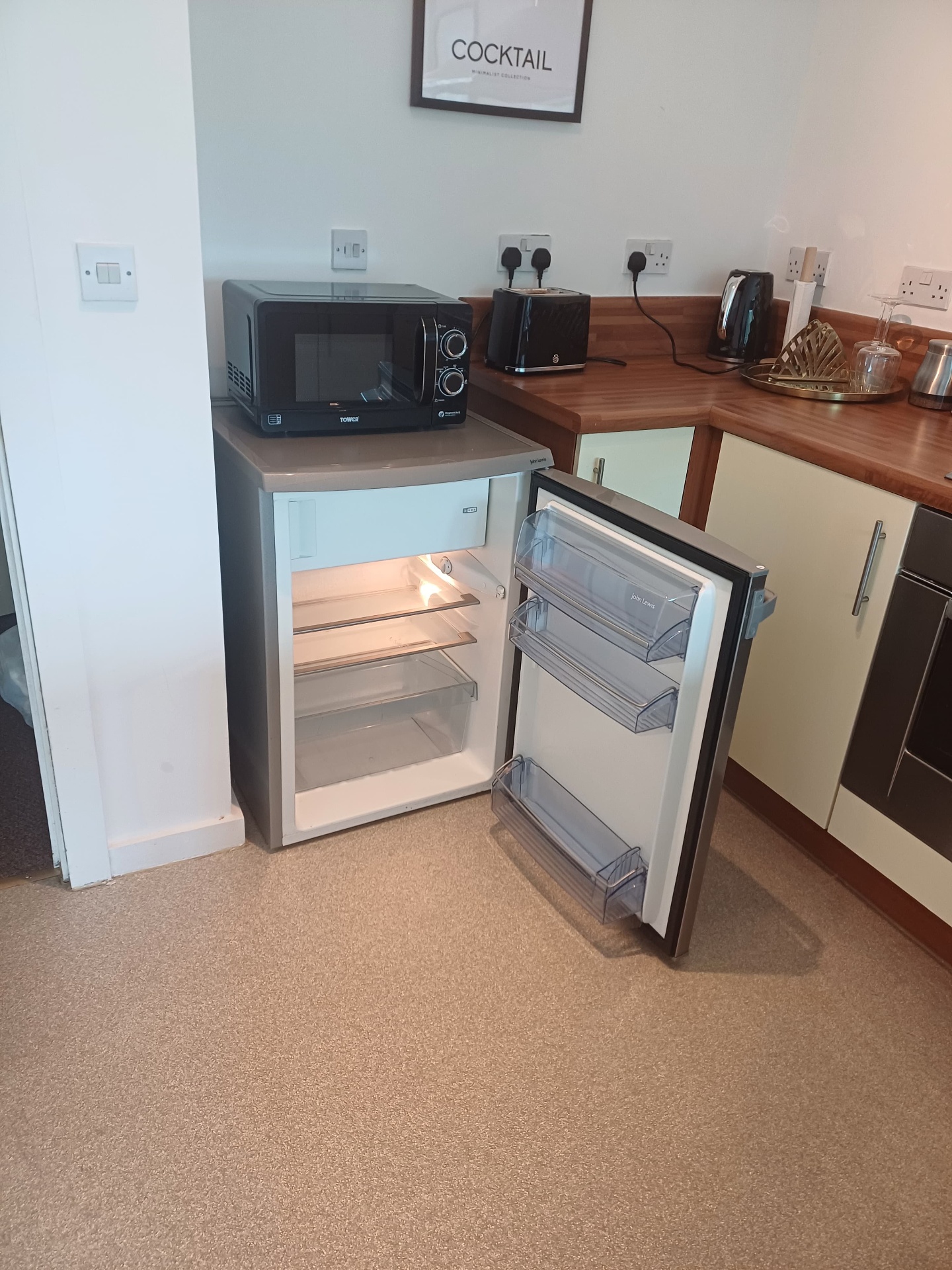 Tidy kitchenette with clean appliances