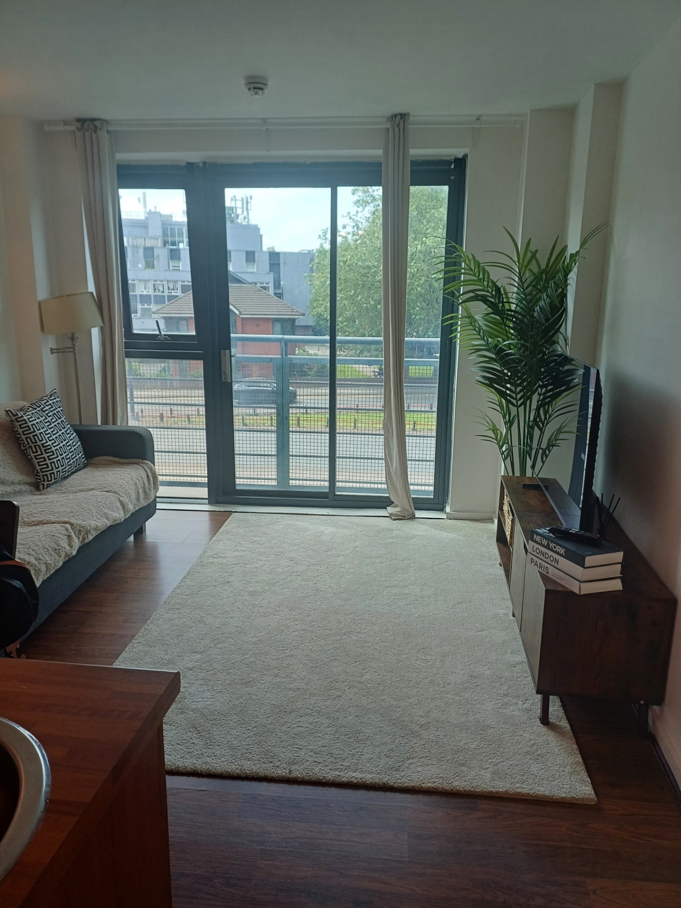 Bright living room with balcony view